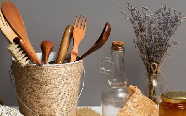 Wooden kitchen utensils in a rope basket